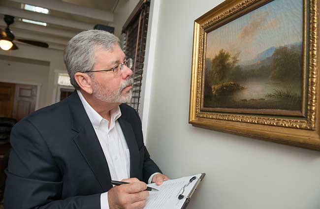 Bob Harrison appraising fine art